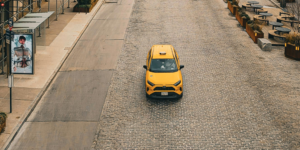 Yellow taxi in the middle of the road